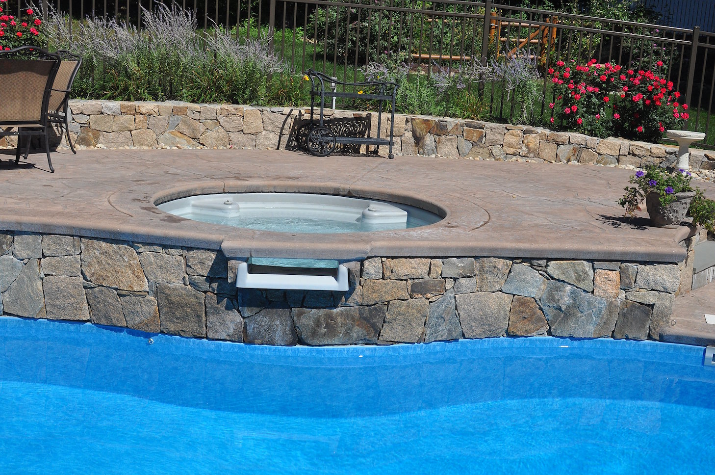 Completed water feature project with integrated hardscape framing